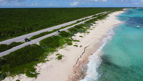 long white sand beach with turquoise ocean on cozumel island in mexico