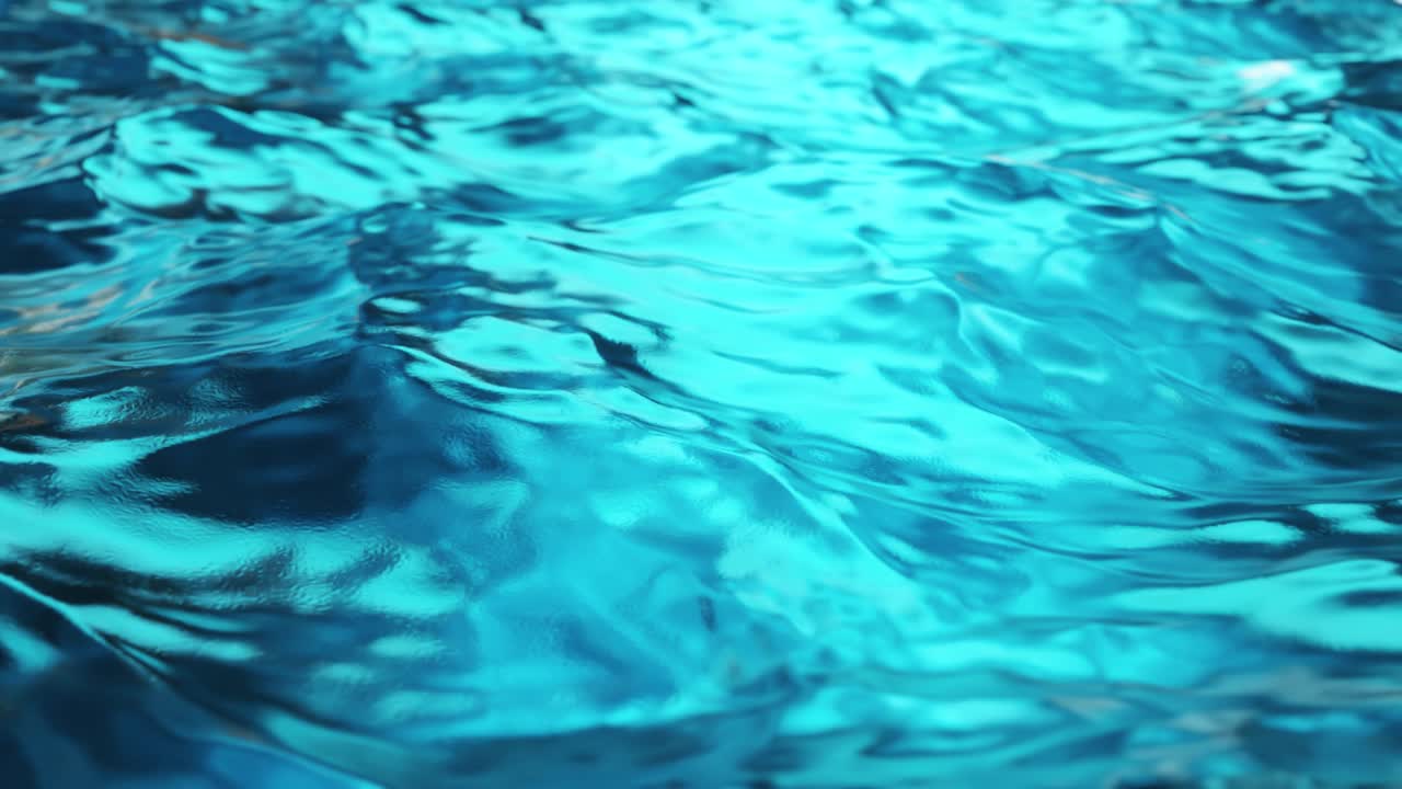 Pure blue water in the pool with light reflections. Slow motion. Seamless loop 3d render