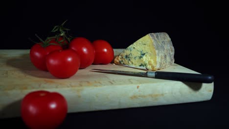 Tomatoes-and-Cheese-on-a-Board-and-Knife---slide-left