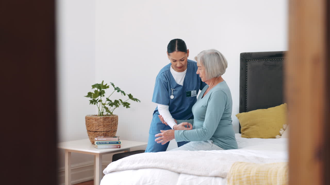 Nurse, walking and helping senior woman from bed
