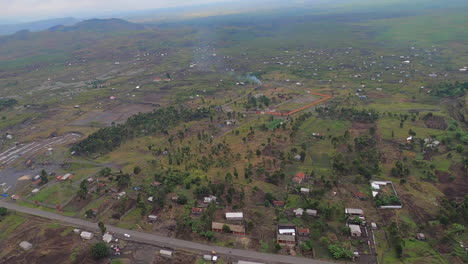 villages dot green landscape on flight west of drc city of goma africa