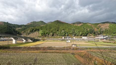 train crossing a bridge in a scenic valley