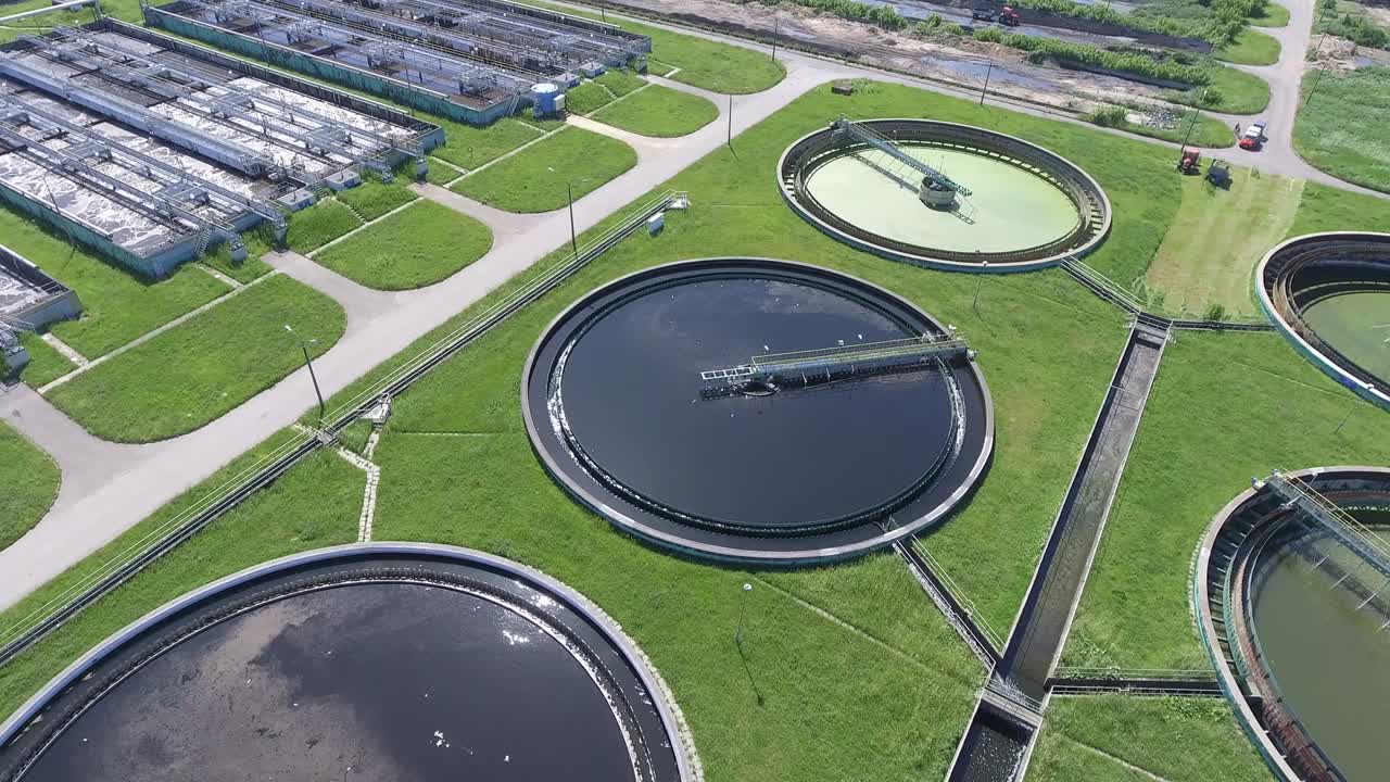 Sewage farm. Static aerial photo looking down onto the clarifying tanks and green grass.
