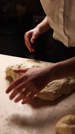 chef kneading dough