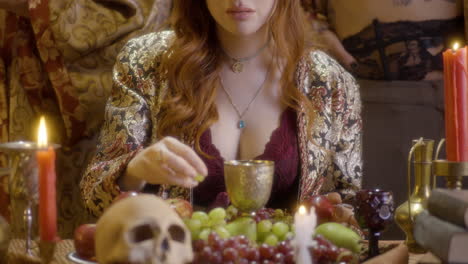 Mystical-Moments:-Redheaded-Witch-with-Crown-Sipping-from-a-Glass