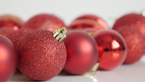 close-up of red bauble with sequins slow tilt 4k video