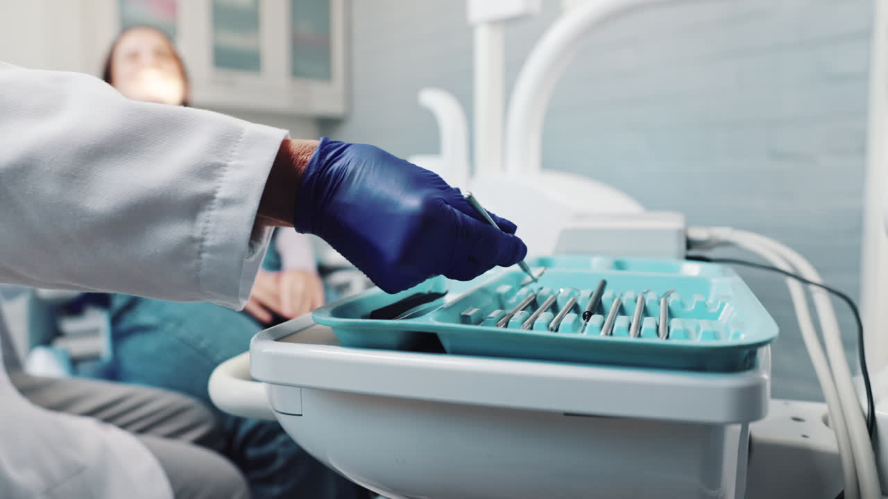 Dental Tools and Patient at Dentist Office