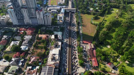 overhead drone shot of bustling edsa (epifanio de los santos avenue) highway during rush hour along santolan annapolis, san juan city, philippines
