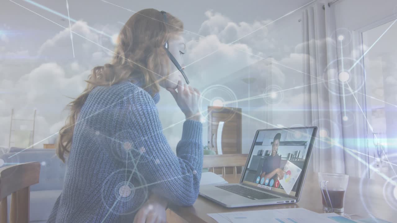 Animation of network of connections over woman using laptop on video call