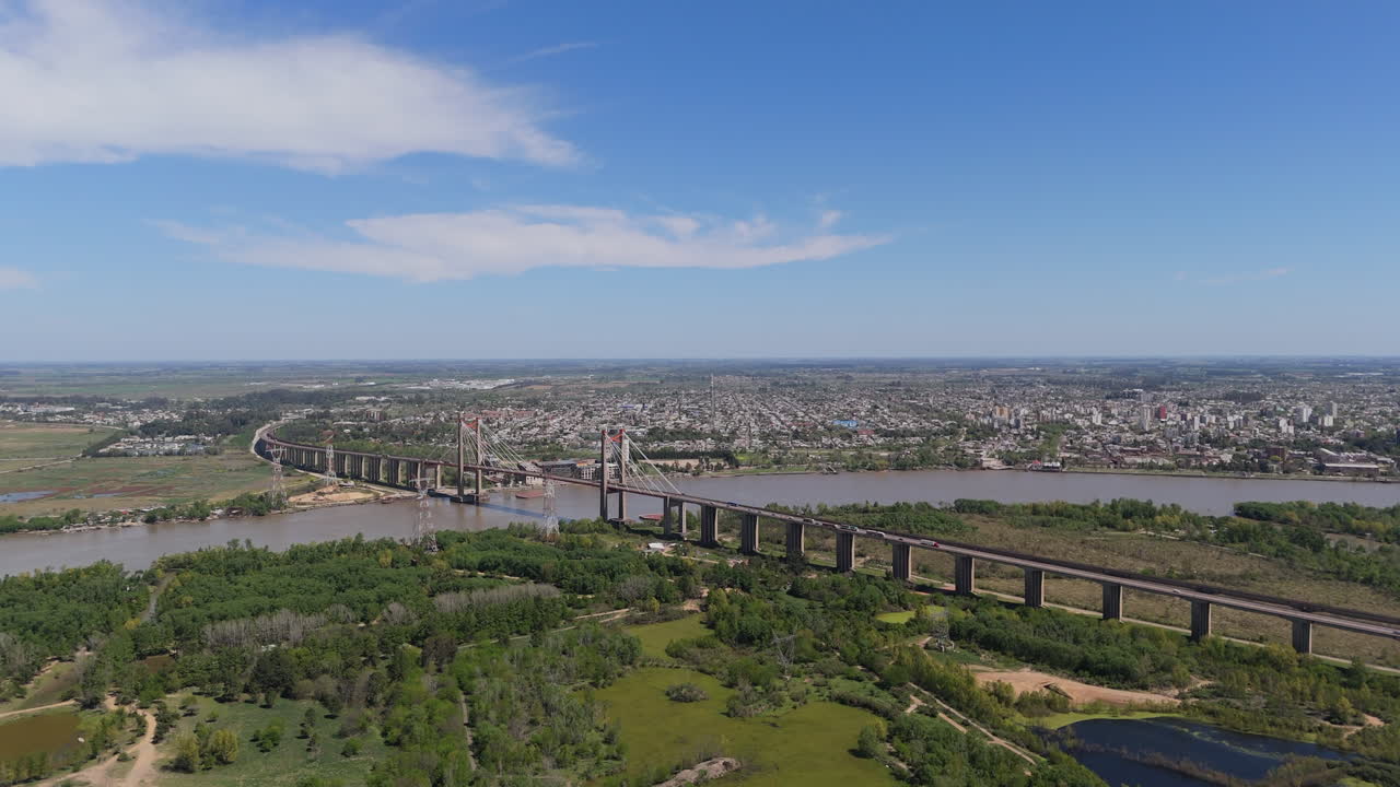 Wide aerial view of the cable-stayed bridge over the Paraná River in the city of Zarate. Buenos Aires, Argentina.