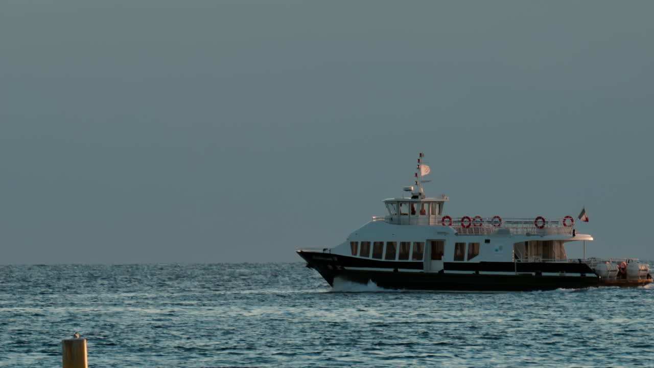 Boat moving on the sea in Cannes, France in the evening
