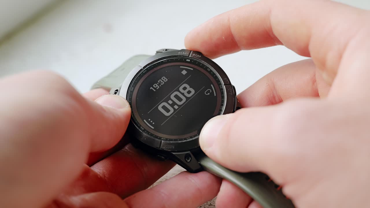 Male hand presses stopwatch button nervously waiting seconds to stop at ten mark