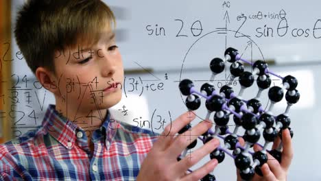 animation of mathematical formulae over smiling schoolboy