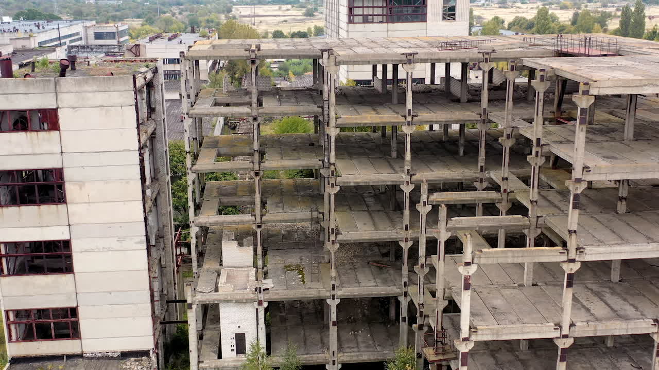 Industrial destroyed city buildings. Aerial view of destructive abandoned architecture.
