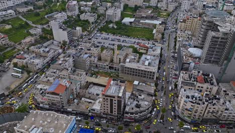 Aerial-View-Over-The-Busy-City-Of-Hebron,-Palestine---drone-shot