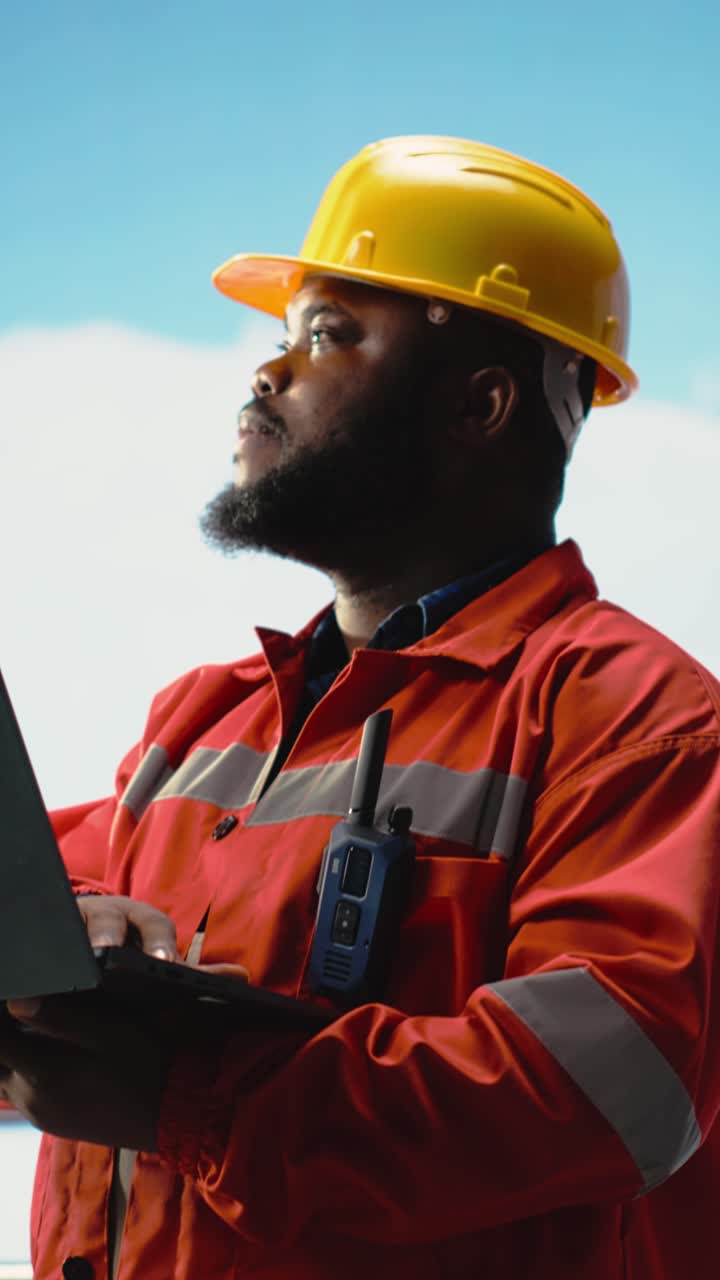 Vertical video Man working on drilling rig ship to reduce ocean contamination