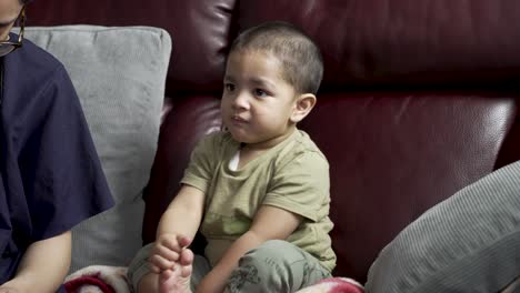 Adorable-Toddler-Being-Fed-While-On-The-Sofa