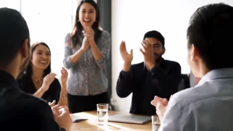 a dynamic team meeting: collaborative discussion and celebration of ideas as participants engage in a positive and energetic atmosphere