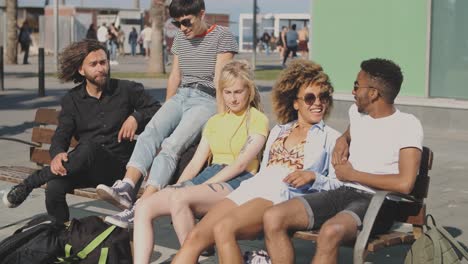 content friends on street bench