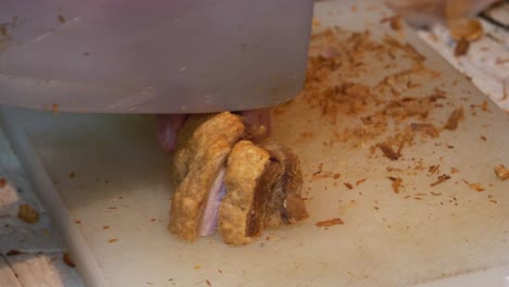 Street-food-market-chopping-deep-fried-pork-booth-Asian