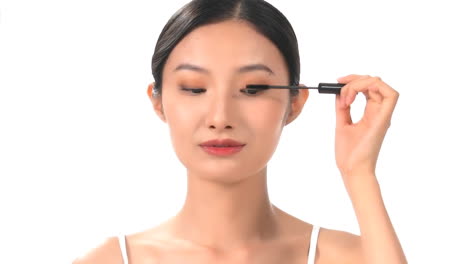 beautiful young girl professional make-up artist works applying eyeshadow eyelid using makeup brush