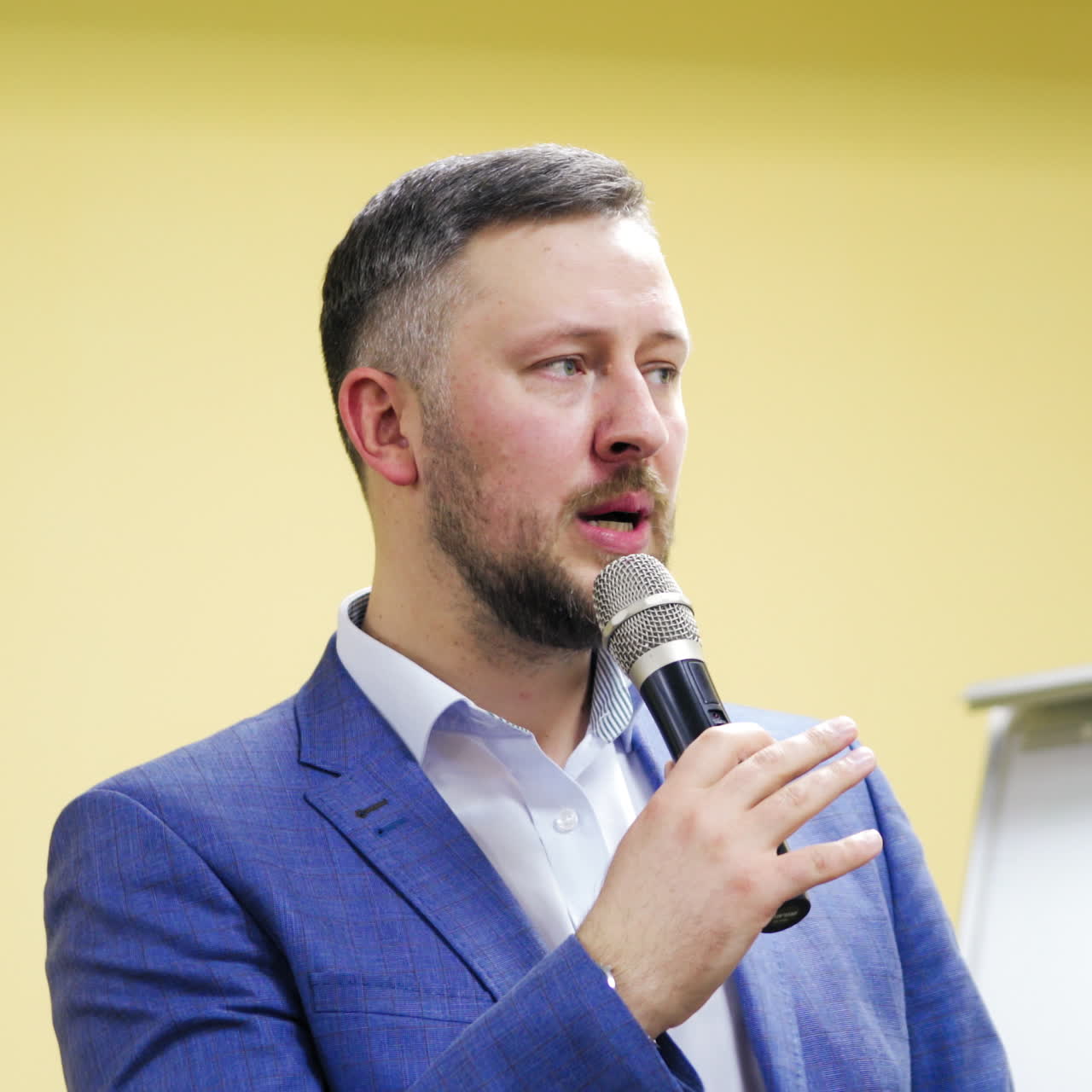 young businessman at business conference room with public giving presentations. Audience at the conference hall. Entrepreneurship club