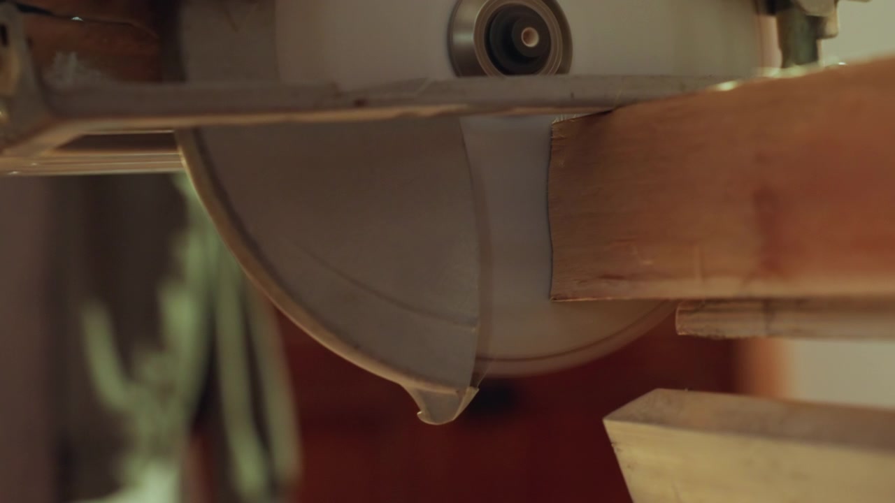 Close up view shows precise cutting of wood by circular saw. interaction between tool and material is emphasized with fine details like sparks or dust particles during cuts. Background