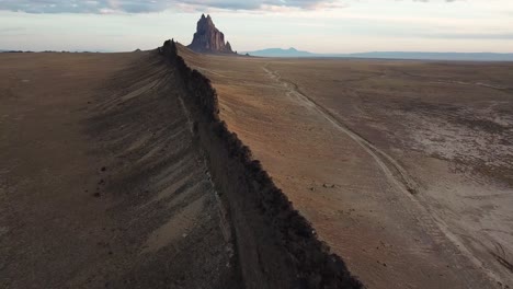 4k aerial flight going around rock formation dike in new mexico