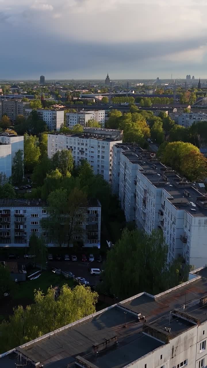 Flying Over The Apartment Buildings In Purvciems, Riga, Latvia. - aerial vertical, tilt down shot