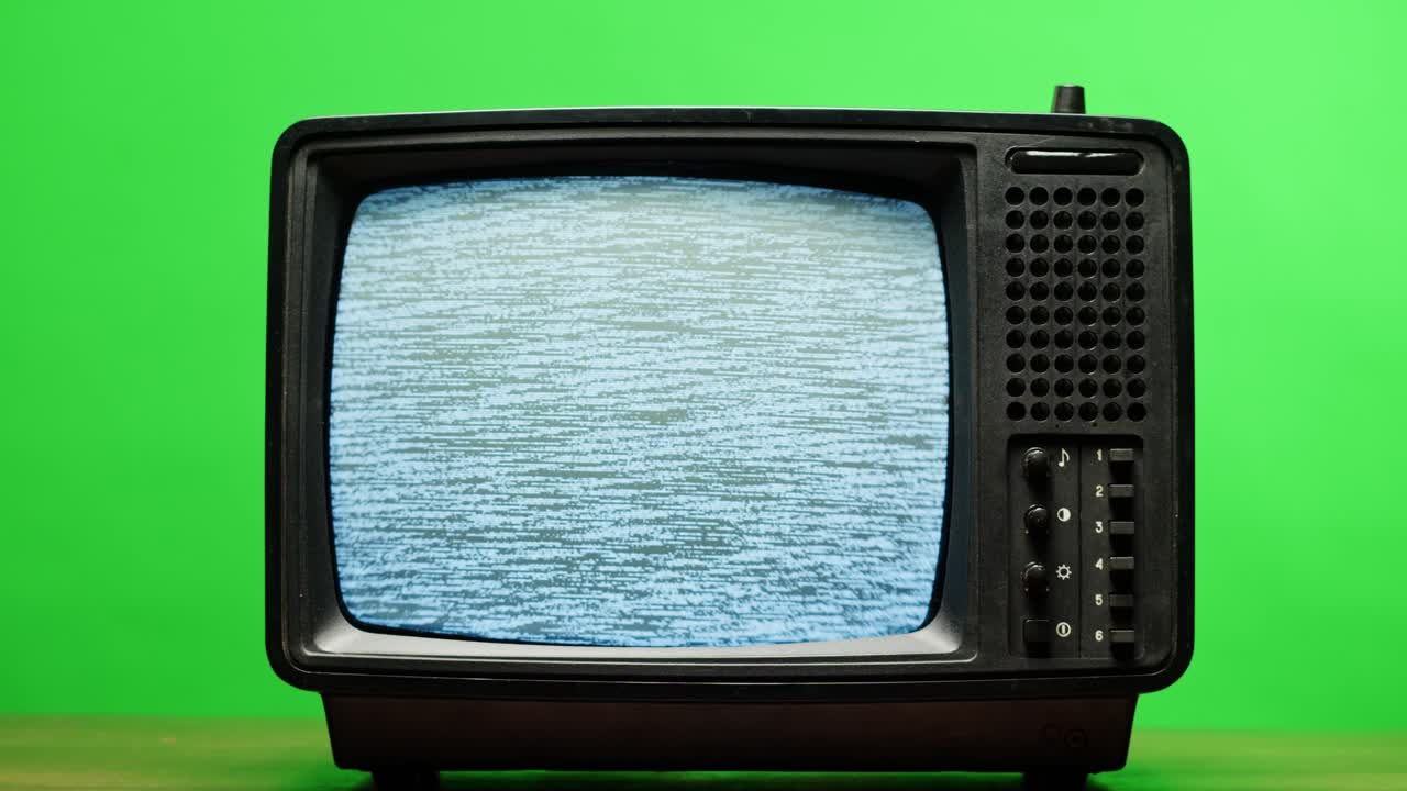 Retro Style TV Set with Green Screen chroma key background, vintage 60s analog television with grain and noise.