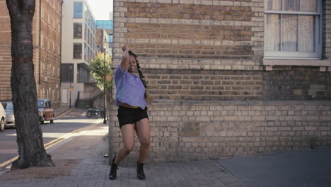 contemporary funky african american woman street dancer dancing freestyle in the city