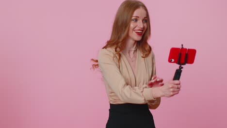 adult girl blogger taking selfie on mobile phone, communicating video call online with subscribers