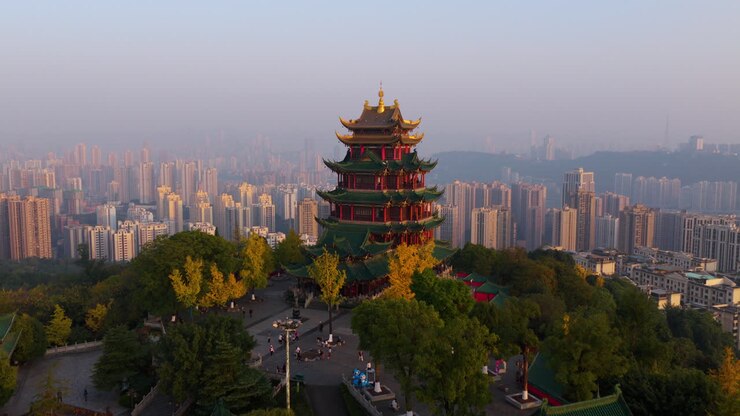 Tourists Visit The Hong'en Pavilion During Autumn At Sunset In Chongqing, China. - aerial shot
