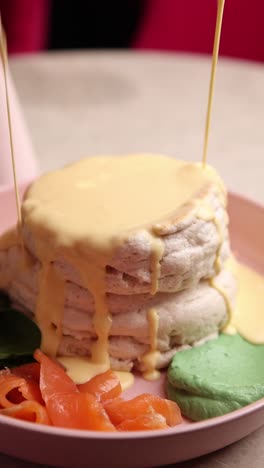 fluffy pancakes with hollandaise sauce and salmon