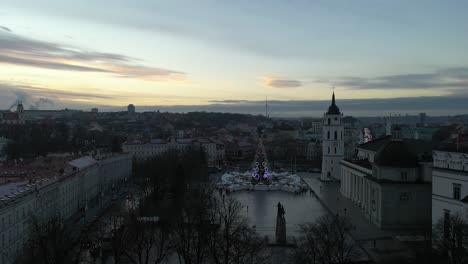 drone aerial view of vilnius cathedral square, winter sunset