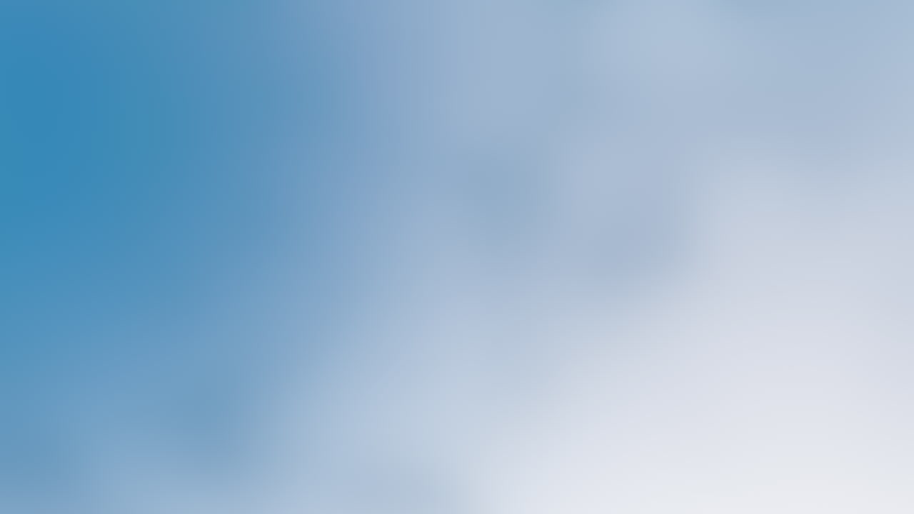 Clear and serene a beautiful blue sky with wispy clouds