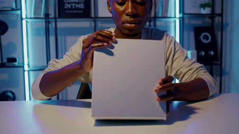 man unboxing a new product