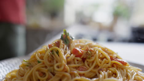 serving just cooked pasta on plate