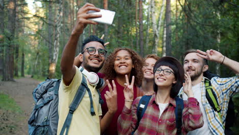 friends taking a selfie in the forest