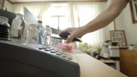 using a smartphone to complete a touchless, contactless payment at a local merchant - isolated close up