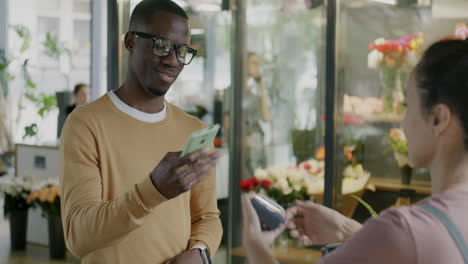 customer interacting with florist in a flower shop