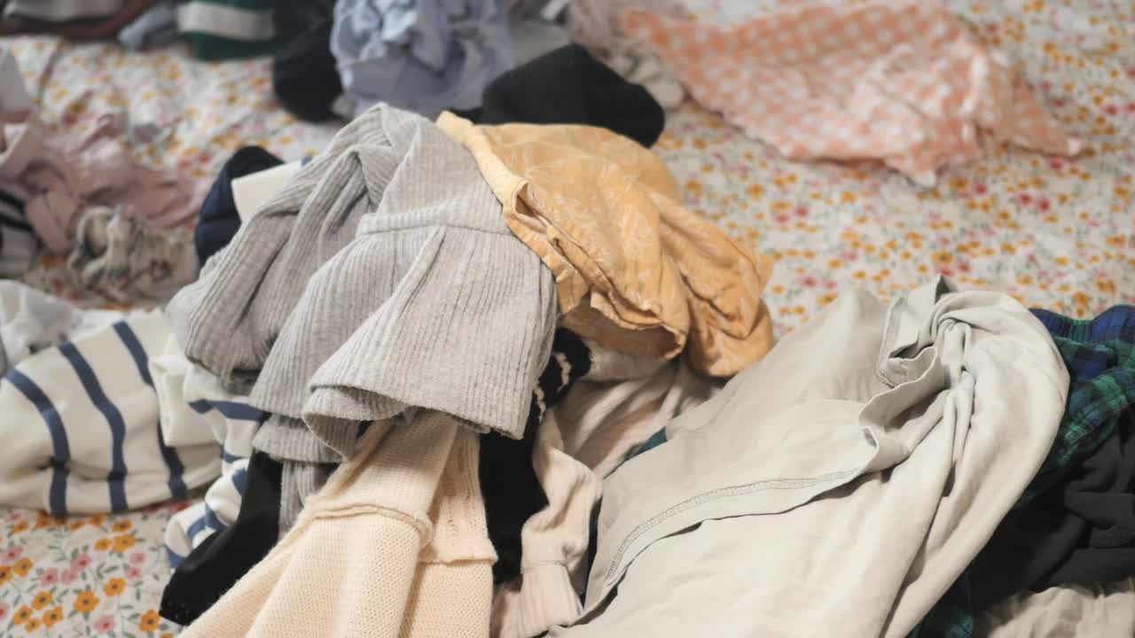 Pile of clothes on a bed