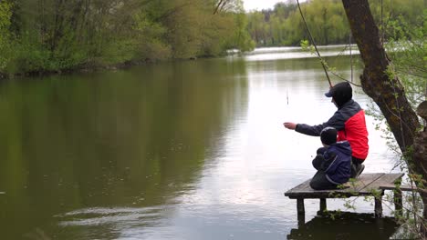 two brothers fishing with a fishing rod 02