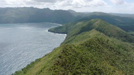 aerial forward shot of the headland and fertile bay of loma papa gorda in samana, dominican republic