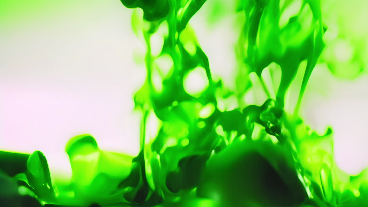 Swirling and mixing green liquid, abstract fluid motion in animation
