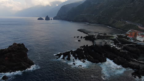 mid-height-aerial-shot-of-the-natural-pools-found-in-the-city-of-Porto-Moniz,-in-Madeira