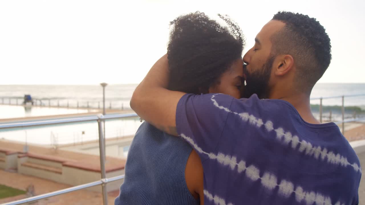 Couple kissing each other at beach 4k