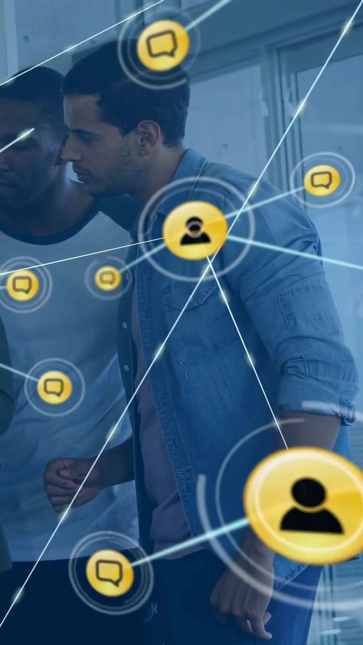Vertical video: Team leaning by glass causing expanding chat icons overlaying scene for biz collab