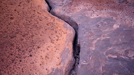 a stunning aerial perspective showcasing the interplay of light and shadow over the red rock desert near lake powell.