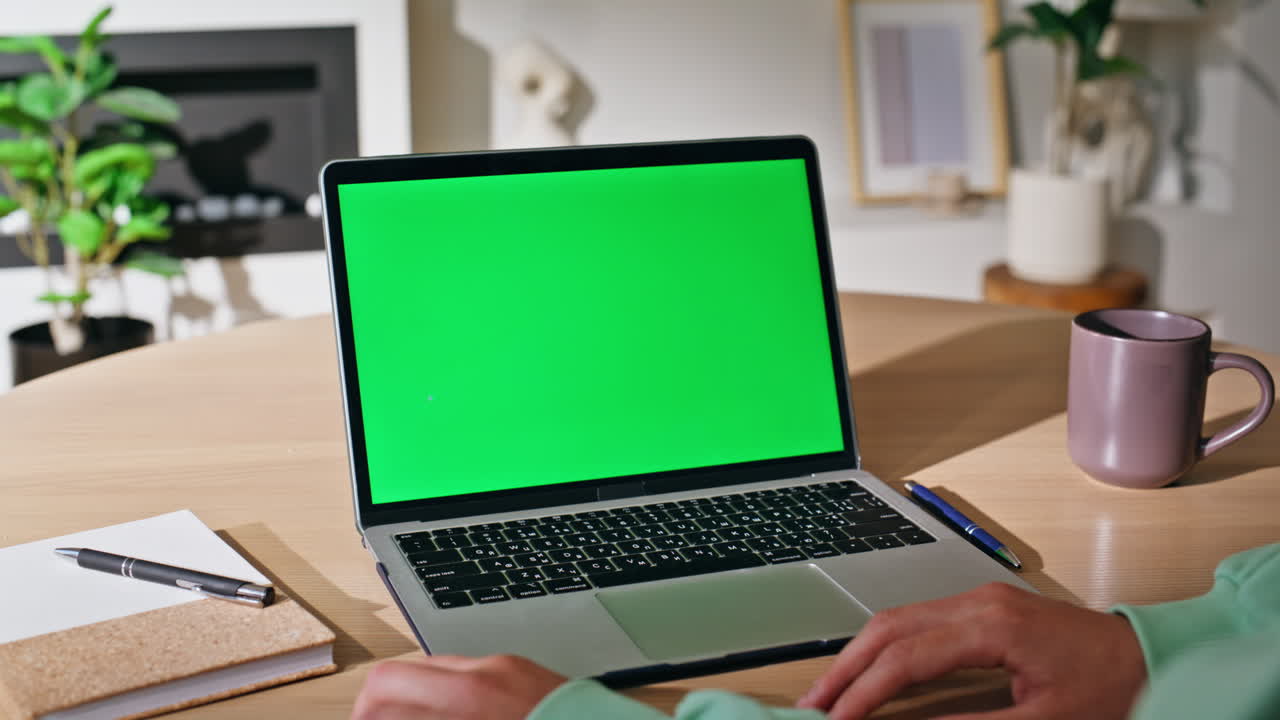 Online student studying chroma key laptop browsing webinar home closeup